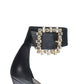 11cm Black Italian leather pumps with adjustable ankle strap with gold-plated buckle and Brass, Pearl Swarovski ornament.